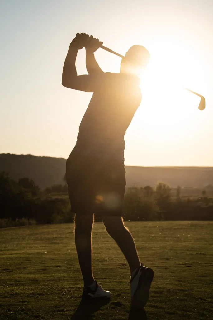 Golfer swinging a club. Perform better, recover better, thrive.